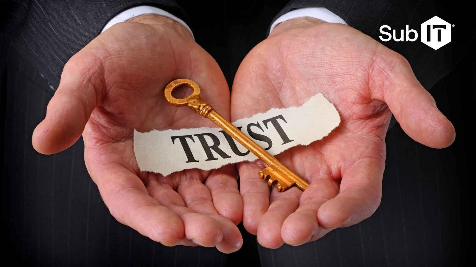 Hands holding key and paper labeled 'Trust'.