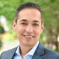 Smiling man in suit outdoors