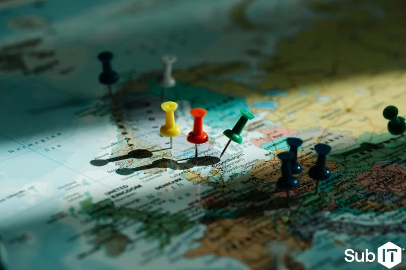 Colorful pushpins marking locations on world map