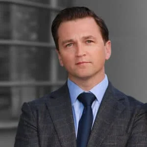 Confident businessman in suit standing outdoors