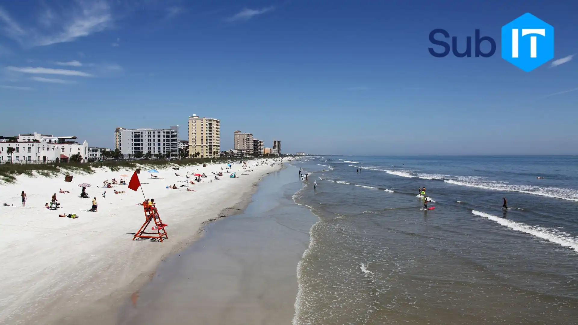 A Florida coastline, with buildings in the background, where local businesses need help desk support.