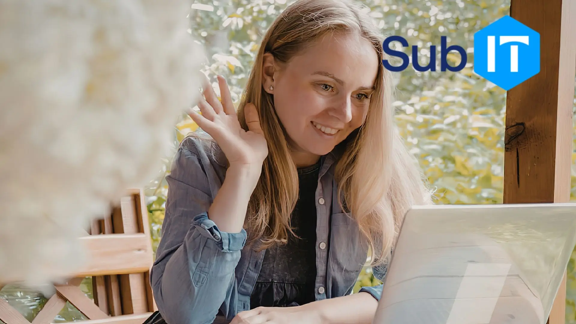 Woman smiling and waving during laptop video call